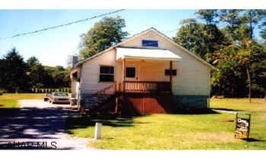 The exterior of this 4 bedroom Capecod in Eldorado is maintenance free. Newer vinyl siding, most windows have been replaced with Andersen windows. Newer covered porches on front and back of house. Large lot 70x289. Inside needs work. 2 downstairs bedrooms The exterior of this 4 bedroom Capecod in Eldorado is maintenance free. Newer vinyl siding, most windows have been replaced with Andersen windows. Newer covered porches on front and back of house. Large lot 70x289. Inside needs work. 2 downstairs bedrooms have been remodeled. Remodeling needs finished in 2 upstairs bedrooms, as well as bathroom. A little work could make this a very nice home. 2 built in sheds under each porch gives great storage space.  Electric system - 100 amp