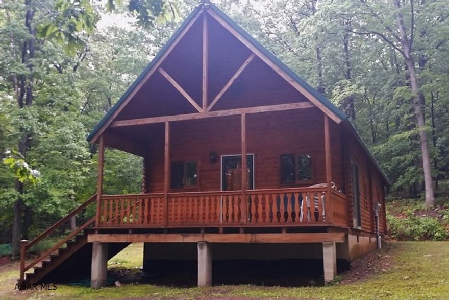 Quality-built A-Frame Log Home near Lake Raystown on 2.7 acre lot. Absolutely beautiful tongue and groove wood interior features kitchen with adjoining dining area, living room with stunning vaulted ceiling and high efficiency propane stove, two first floor bedrooms and bath plus spacious loft for a very comfortable 3rd bedroom/sleeping area. Relaxing covered front porch and nice, level lot with fire pit area. Very ample closet/storage areas. Very high quality craftsmanship throughout. Durawood Premium hardwood floors. Just moments from Lake Raystown activities including boating, swimming, golfing, ATV/bike trails, hunting, fishing and so much more.