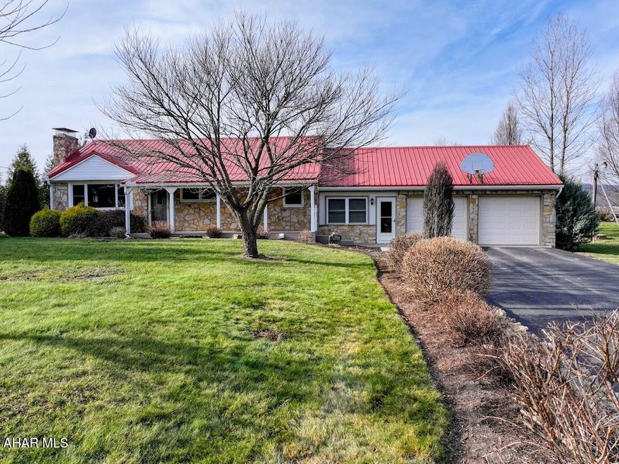 Come to the countryside with this gorgeous stone rancher situated on a level .93 acre lot. Enjoy panoramic views of the surrounding mountains and farm fields while relaxing on the front porch or a fireside chat around the firepit located in the backyard. This home boasts an updated kitchen with granite counters, tile flooring and dining area with loads of storage. The living room features a lovely stone woodburning fireplace and the basement family room includes a woodstove to keep you warm and cozy. The economical geothermal heating system and central air will add to your comfort in all seasons. Four sheds - three with electric and one that also includes a workshop, loft for extra storage and heat while tinkering with projects. This home won't last. Schedule your appointment right away.