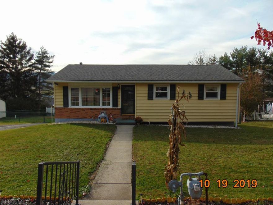 Vinyl sided Ranch Home, with fenced in rear yard. Covered porch, 3 bedrooms, 2 bathrooms with eat in kitchen and finished basement