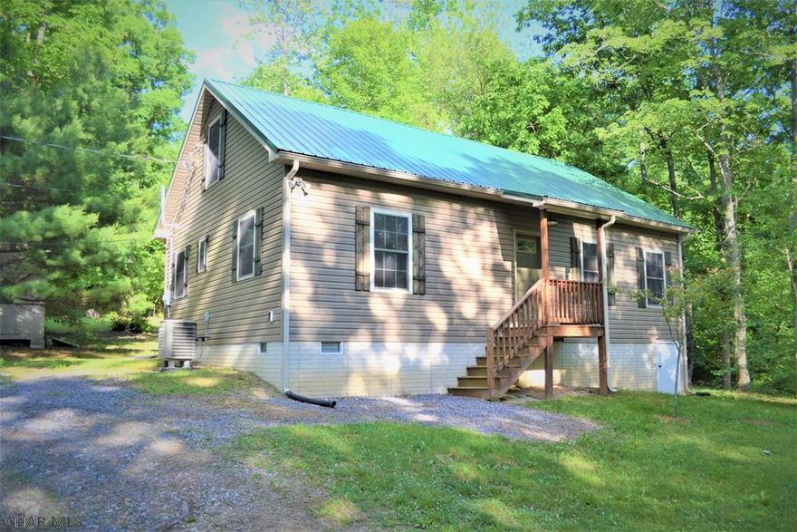 A wonderful escape to the mountains of central Pennsylvania!  Situated on 3.9  acres and located just 20 mins from Lake Raystown this newer constructed cabin is the perfect getaway or full time residence.  Beamed cathedral ceilings in the open concept living room, kitchen and dinging area.   2 main floor bedrooms and a large loft  have ample sleeping area.   Energy efficient  heat-pump with central AC for comfortable living year round.   Covered wrap around porch over look the wooded back yard and fire pit area.   This one is sure not to last, give us a call today!