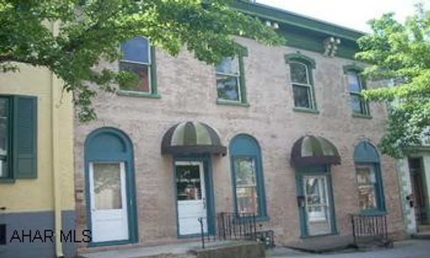 Office building with two apartments. Located in Historic Downtown Hollidaysburg. Office building with two apartments.