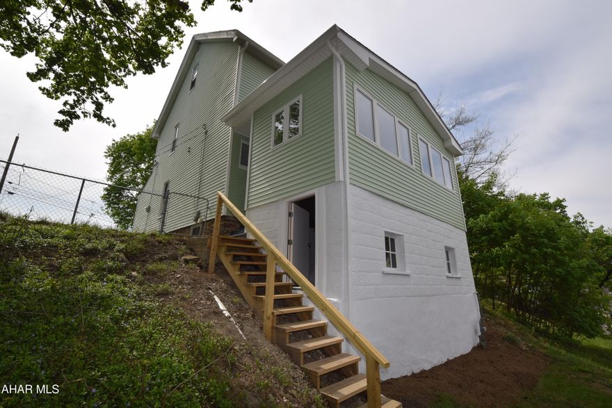 Totally remodeled 3 bedroom, 2 bath home.  First floor features  eat-in kitchen, dining room, living room, full bath and three season enclosed sun porch with tons of natural light.   The second floor has three very nice size bedrooms and full bath.   Home has newer floor coverings, replacement windows, central air, new roof in 2025, and vinyl siding.   There is off street parking in the rear for three vehicles.  Plenty of space to build a garage.  The yard is spacious for kids and pets.   Don't miss this opportunity for homeownership at an affordable price.