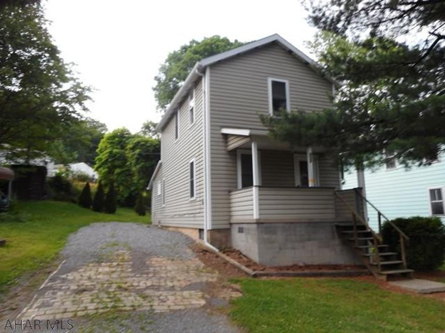 Remodeled two story two bedroom home with vinyl siding, newer roof and windows, pergo floors --move right in!!