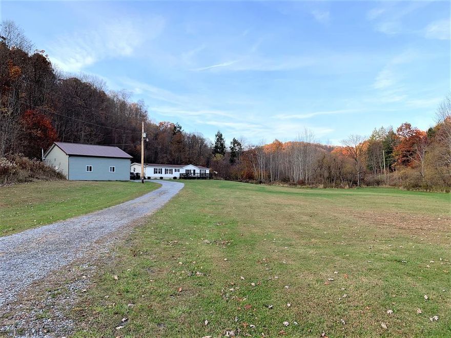 This double wide home offers 1,976 square feet to spread out!! Featuring a living room w/ pellet stove, kitchen with island, dining area, sunken family room, a sunken master bedroom suite with full bath, two additional bedrooms, another full bath and a laundry/mud room. Home rests on a full concrete block basement. Private water and sewer, oil forced air heat and 200-amp electric. Updated architectural shingle roof, large front deck and side deck. Detached four-car insulated garage with oil heat and water. FIVE (5) acre lot with large front yard. Close to Blue Knob Resort offering skiing and golf, hiking and biking trails. Convenient to Bedford and Altoona.