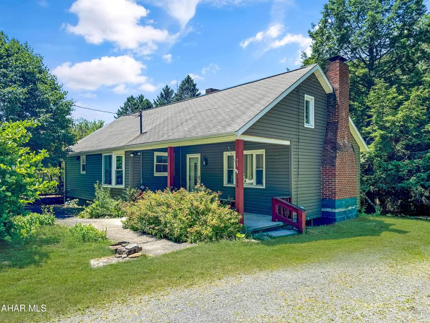 Welcome to 296 Fords Corner Road in the Central Cambria School District, Jackson Township. This gorgeous 2 bedroom, 1 bathroom home offers privacy, character & practicality. As you enter the main floor you are greeted by a breathtaking living area with a vaulted wood ceiling & a wood burning fireplace. Off of the living area is a dining room, spacious kitchen w/ plenty of cabinetry, first floor bedroom, first floor bathroom, & various storage areas. The upstairs includes your 2nd bedroom and a closet. The basement is unfinished but is excellent for storage. The exterior of this home includes an oversized detached 2 car garage, private yard w/ creek bordering the property, & so much more. Call today to tour!