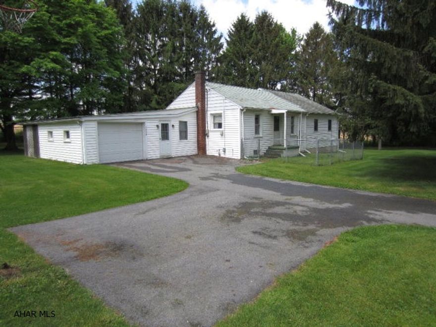 Nice 1 1/2 story, 3 bedroom, 2 full baths, 1 car attached garage sitting on 1.93 acres of country living.  Three storage sheds. Screened-in covered patio, recently updated kitchen.  Comes with appliances.  Bonus room on 2nd floor. Central Air.  A second residence is on property, a trailer with full length addition, with framed roof over trailer.  Ready to occupy and has it's own septic and electric systems.  Great for a rental.