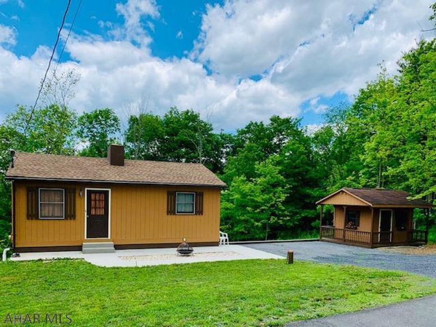 A country cottage, residence or recreational get-away has endless possibilities.  With its stunning stone fireplace is the center attention in this quaint home. Beautiful views of Dunnings Creek down the hill and easy access to the creek. Great for fisherman, kayaking or a place to relax. The 20x12  he shed, she shed with wraparound deck would be great for guests, air B&B and family visits, 100 amp electric included! The unfinished basement could be finished for additional living space. A new 16 x 12  back deck is installed with picket railing. New side walks new roof.  There is also room to build a larger home.  Mostly wooded 11.21 acres has been recently select timbered and there is still mature timber value left.  Drive byes only ---Please no walking the property Only with Realtor.