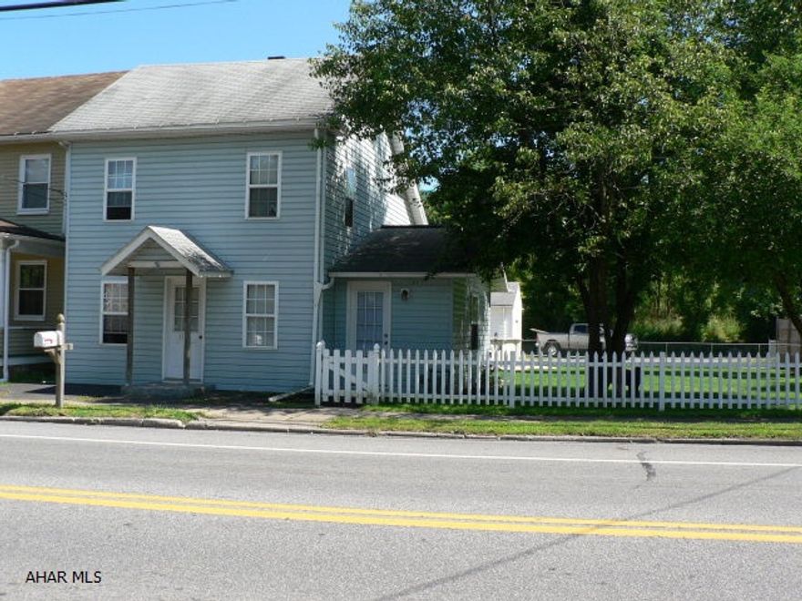 This is a nice home with a fenced in yard on a double lot in the Duncansville borough. It has a large living room with a hookup for a gas fireplace with a computer room located off the living room. The kitchen has had its hardwood floors refinished and furnished with stainless steel appliances. Located upstairs is a sitting room, two bedrooms with closets and a full bathroom with a jetted tub. The over-sized garage has a work bench that has airlines run through the garage from the air compressor. There is also wiring for an intercom run from the garage to the house and just needs hooked up. All parts for that will be left.  With an above ground pool that has a deck and gazebo, this home is a great place for entertaining.