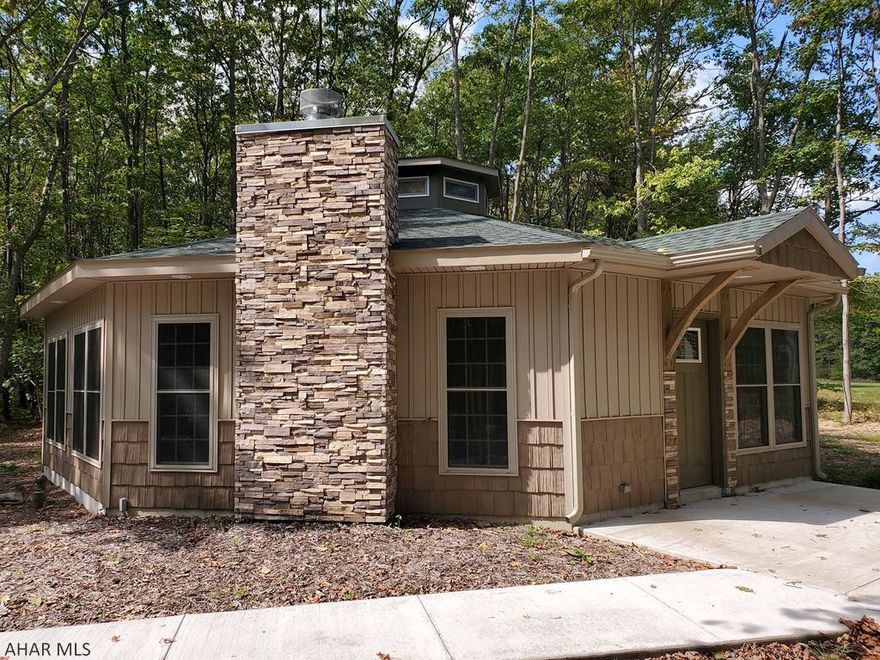 Step inside this beautifully finished NEW CONSTRUCTION Octagon home overlooking the 5th hole of the Blue Knob 4 Season Resort Golf Course.  Feel the warmth from the wood burning fireplace with a reclaimed barn beam mantle and surround, accented with knotty pine cathedral ceilings and a 72" 8 blade ceiling fan.  Relax and unwind with the Thermostatic Waterfall style Shower Towers in each bathroom.  Very low maintenance exterior landscaping with an oval driveway and a parking area for multiple vehicles.  The very low HOA fees cover the road maintenance and trash collection.  The Octagon style home is very efficient resulting in low heating expenses.  Call today to schedule your private tour.