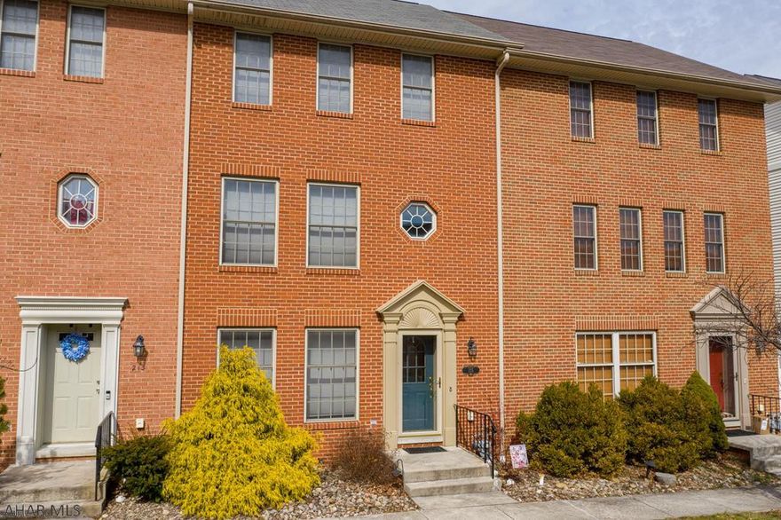 This beautiful 3 story brick townhouse was built in 2002. Open concept kitchen with a beautiful view of the patio. Large 2 car detached garage with room above for storage.