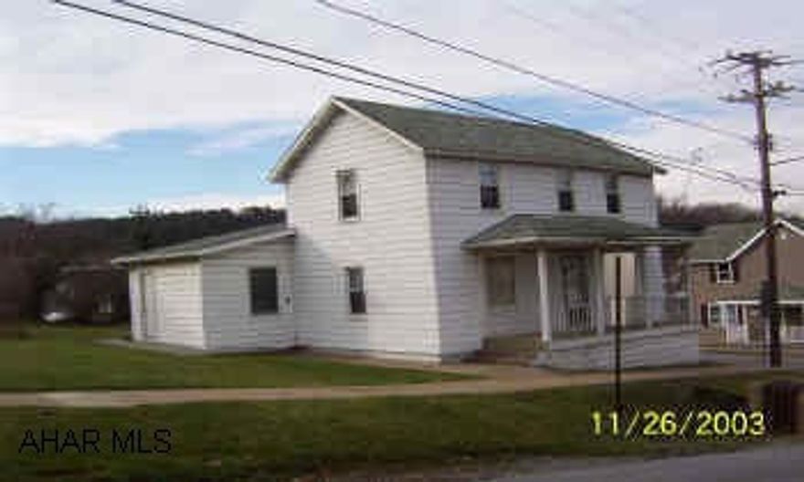 2 story aluminum home on a double lot.
