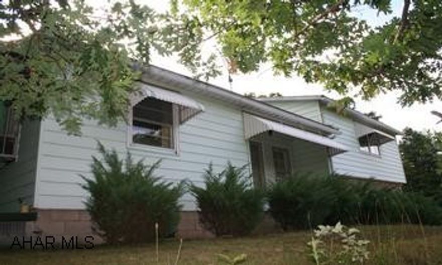 Tri-level 2BR/1BA house situated on pituresque lot with large trees, views and private setting. Spacious living room with woodburner, cozy family room with fireplae. Stained glass adds character to the dining room.