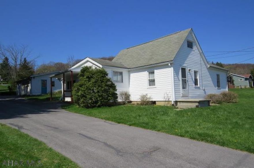 Location Location Location! This Eldorado gem has it all! Located on a quiet street with more than a half acre of yard this 3 bedroom 1 full bath has endless possibilities. The garage has room for 2 cars and an additional workshop room along with a driveway for more parking. A kitchen, livingroom, dining room, full bath, and two bedrooms make for perfect one floor living, but the second floor has a bedroom with built in beds for an additional room or storage. Call listing agent for your private showing before it is too late because this one will not last!