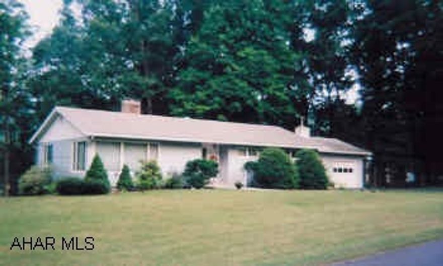 Attractive single story home w/2 car garage, 3BR, 1 1/2 baths, 2 fireplaces, finished rooms in basement, vinyl siding, great setting. Price change now includes Lot # 22