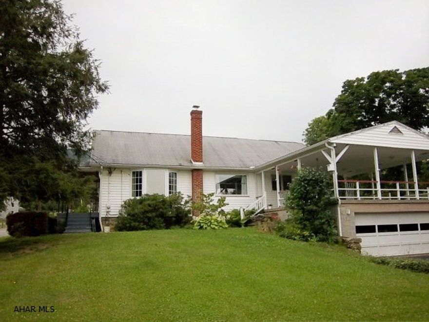 One story living on huge lot with 3 BR, HW floors, 1st floor laundry and 2 car garage. Additional 50X250 lot goes with sale of the house. Private setting and priced to sell.