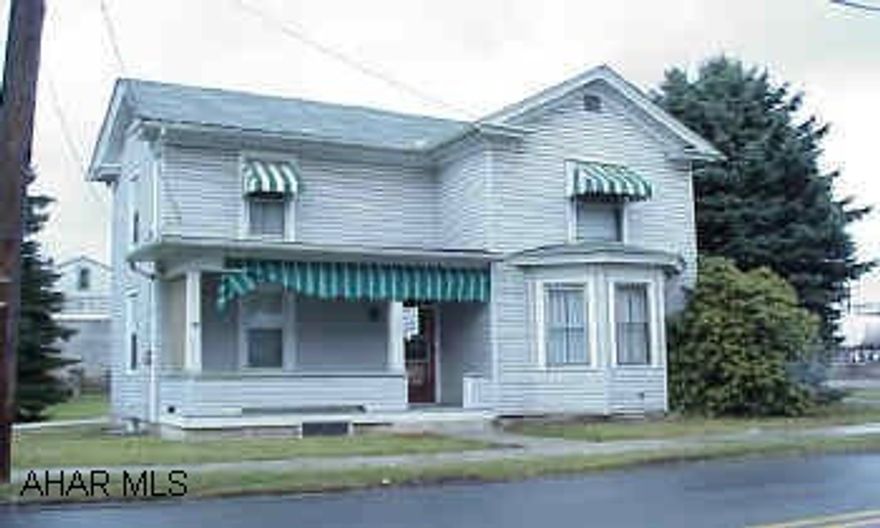 3 BR home with Nat Gas HW baseboard heat, mostly new windows, & new 100 AMP wiring.  Small BR on main floor with 3/4 bath & living room with bay window & AC wall unit.  Features some hardwood floors under carpeting, covered patio, front porch, & closed-in heated back porch.