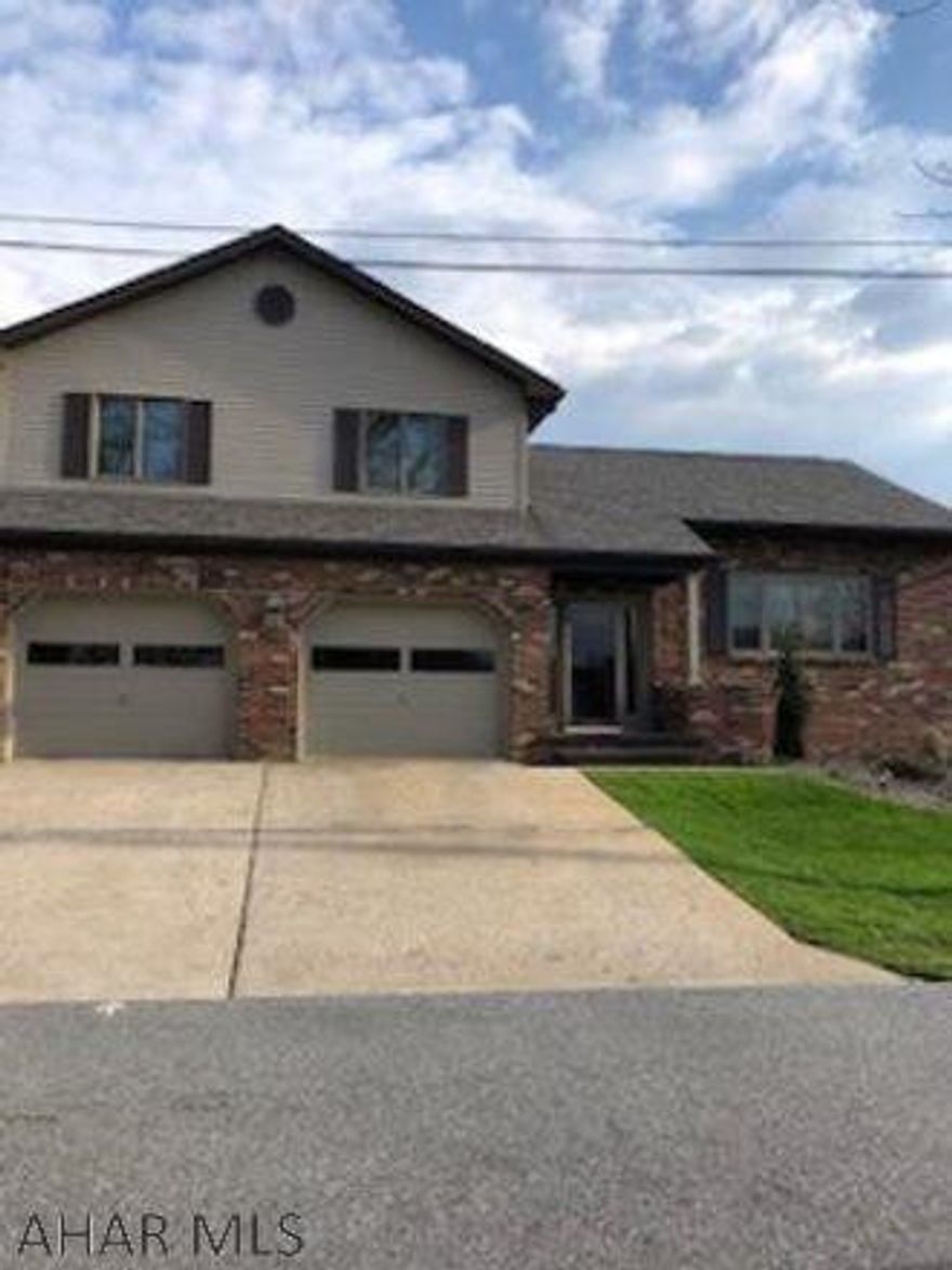 Outstanding Multi-Level home has 3-4 bedrooms, 2.5 baths, sunken living room, new kitchen with breakfast bar and quartz counter tops, dining area, screened brick patio with skylights, family room has wet bar with a stone wall & gas fireplace, den/or 4th bedroom, laundry/powder room combo, ample storage, central air, 200 amp breakers, finished 2-car attached garage plus a one-car detached garage.  Many updates include new roof, windows, siding, and mechanicals.  Large pantry, walk-in cedar closet, 3-zoned gas heat, and professionally landscaped.  This home retains the value of peaceful living while being convenient to the elementary school and shopping area.  Turn key ready! **May need delayed possession.**