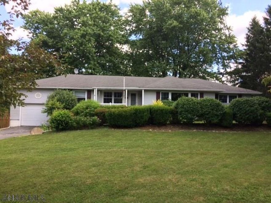 This spacious 3 bedroom, 1.75 bath ranch home is sitting on a large lot in a great neighborhood. The updated kitchen has plenty of cabinet space and tile flooring. Off of the kitchen is a room that could be used as an office or a playroom and a .75 bathroom with first floor laundry. Hardwood floors throughout. The living room features a picture window and gas fireplace. Home has a new furnace. Entertain family and friends on the beautiful new deck with fenced yard. Along with the attached garage you can park your golf cart in the over-sized 2 car garage. Must See!