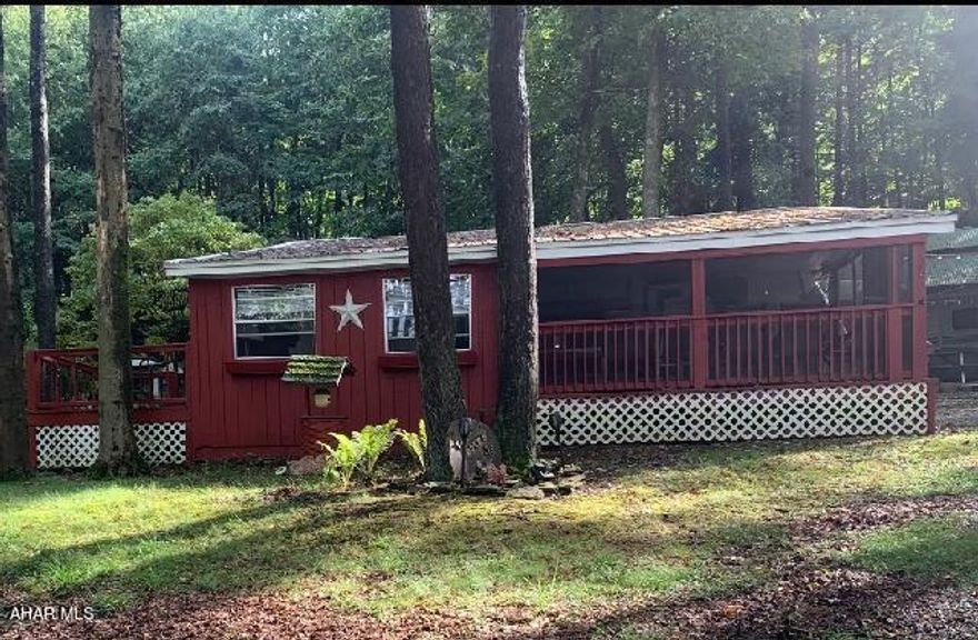 Have you ever dreamed of owning your own camping area ? Dreams do come true  with this property. At Glendale Yearound  you can live there all year round or a weekend get away . Which ever you choose this site is for you. Some of the features are  screened in porch, Den with gas wall heater and Tv, Living room with sofa and built in radio, kitchen w/ stove, refrig, table that folds into a bed, 2 baths 2 bedrooms, breezeway w/ wood burner, sink, refrig, storage, attached sheds, back deck , carport  and more ...This is all listed for $45,000. call for a showing today