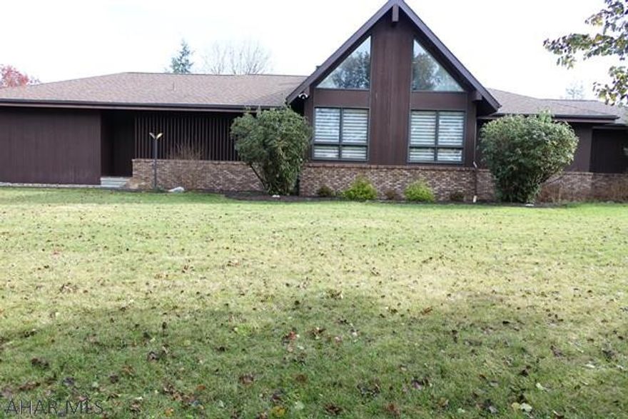 Spacious, Custom Built Home in the Heart of the Borough!  Easy, 1 story living with a spiral staircase to the sunny loft bonus room.  Vaulted ceilings add to the roomy, airy feel of the whole house.  Sun Room boasts cork floors, doors to the deck and plenty of skylights.  Kitchen has a center island, 2 sided built-ins, breakfast area and a desk work space.  Dining room shares the kitchen floor to ceiling built-ins and is step away from the sunken great room.  First floor laundry.  All appliances stay including the washer and dryer.  Basement is just waiting to be finished, but already has a completed full bath.  All of this on a spacious, flat  2 acre lot in the Borough!!!  Close to schools and easy access to Plank Rd, Juniata St and and I-99.