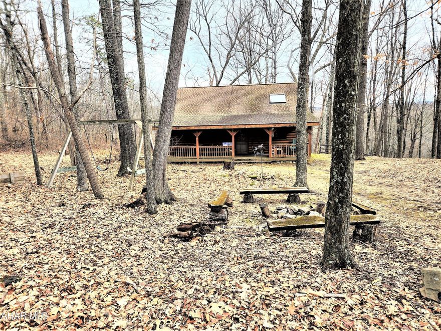 Are you looking for a weekend retreat to enjoy the soltitude of nature?  Come take a look at the meticulously maintained log cabin located in southern Bedford County.  You'll see the attention to detail that was used in crafting this outstanding cabin.  The great room features cathedral ceilings with a stone hearth fireplace that extends to the ceiling.  It has tongue & groove pine walls and ceilings and exposed beams.  The kitchen features a breakfast bar with hidden storage.  The spacious loft has enough room to hold 4 beds for family get togethers.  You'll have your choice of sitting out on the deck or on the front porch while enjoying your favorite beverage.  Children will en;joy their own private space with the playhouse located on the property.  Enjoy over 8 acres of land that is located within a short walk of Buchanan State Forest.  This property is located close to the Maryland border and within a short drive to Interstate 68, Rocky Gap, and Cumberland Maryland.  It offers good access to Interstate 70 and PA Turnpike.  Buyer is required to become a member of the Piney Grove Property Owners Association.  Acreage and square footage came from public records; buyer to verify.  Buyer does not want to close before 6/1/2023.