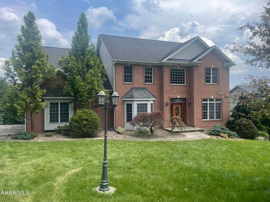 Welcome to 316 Woodlawn Terrace!!! This brick front home situated on .57 acre. Walk into the foyer with high ceilings and beautiful natural light.  Front office with hardwood floor. The entry flows into the dining room which is off the kitchen. Open concept kitchen, eat in area, and living room. Living room features a beautiful stone fireplace.  This once 5 bedroom home is now a 3 bedroom with a laundry room. Keep it that way or easily change back.  This includes the primary bedroom with primary bathroom. The tile bathroom features a jet tub and tiled shower. The basement is finished into family room with kitchenette.  Full bath. Utility room. Full garage lower level perfect for yard tools and workshop! Oversized 2 car garage that is attached with mud room entry. Bring your imagination, this home needs some TLC.