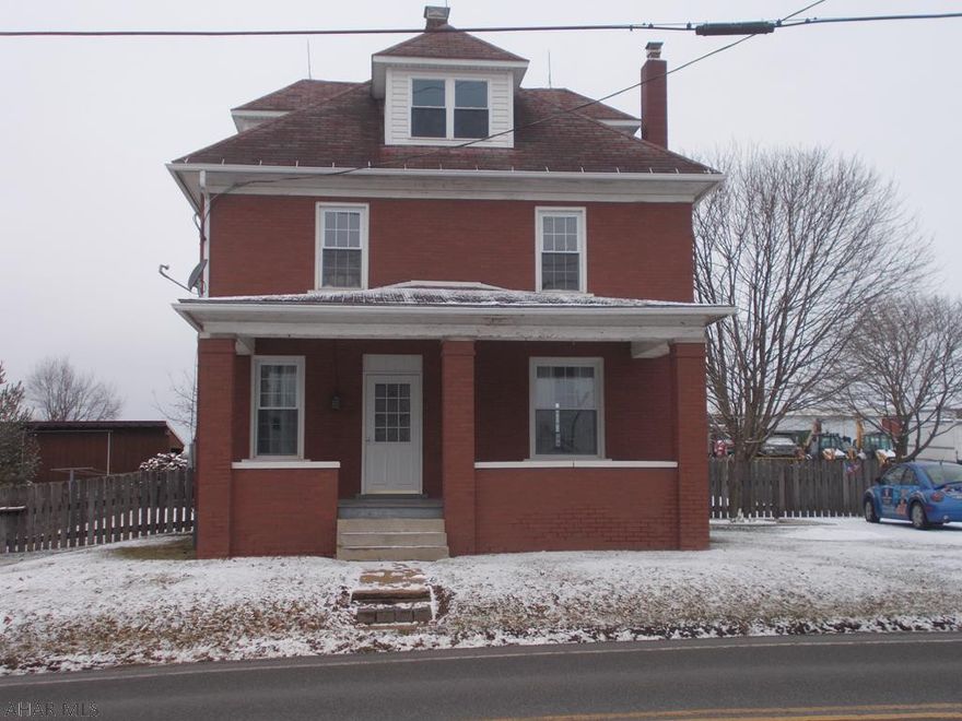 Super unique property in the cove! 4 bedroom, 1.5 bath brick home with original woodwork! Partially finished basement, new back sun porch, new dormers, new basement windows and the whole house just got all the brick re-pointed! The house has oil heat and also has wood burner in basement. Property has a 24x42 garage that is 100% finished on the inside! Radiant heat, its own septic, 1/4 bath, water, cable, phone/internet. Completely finished with drywall and oak trim! The ultimate (MAN CAVE).  So large, you could live in this garage! Property also has an outdoor furnace that is tied into the house and the garage; an economical way to heat! Behind the garage is a large garden already tilled and ready for planting season.
