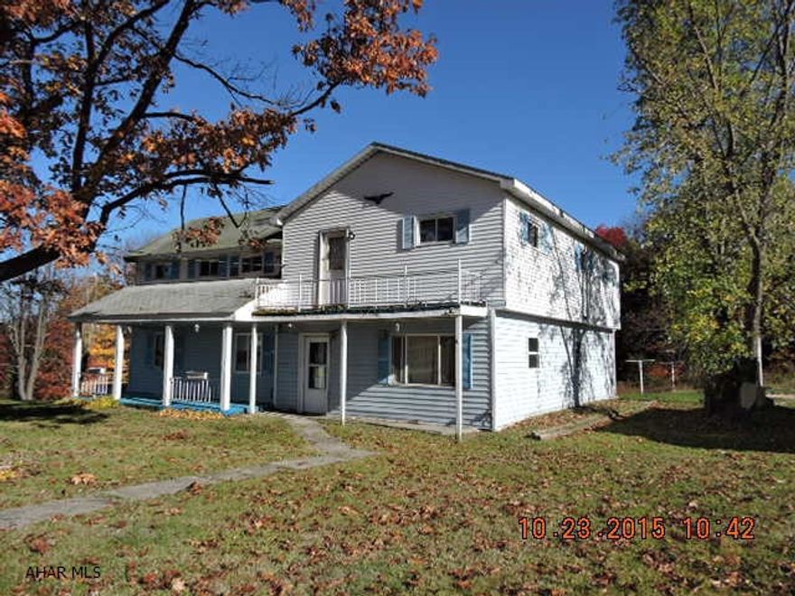 Terrific views.  Handyman special on nice lot with 5 car detached garage.  Furnace is not functional evidence of freeze damage & structural problems.  Use caution.  Old mobile home on property with no title.  Well & septic are unknown.  AS IS SALE