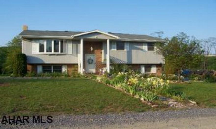 OPEN HOUSE SUNDAY, SEPTEMBER 26TH FROM 4 - 5:30 PM............COME AND ENJOY!!   Lovely bi-level in Claysburg on large country lot with many perenial flowers. Cul-de-sac road. 3-4 bedrooms, 1.5 bath. Country living with convenience to many.    Family room with woodburner in basement and possible 4th bedroom.  1 car garage. Office has appraisal on file -  Great price!!