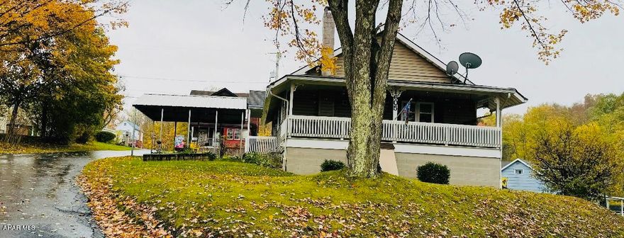 This charming corner lot won't disappoint!  This home features 2 bedrooms, 1 full bath, 2 half baths, and a bay window in the living room. Kitchen has oak cabinets that provide lots of storage. This home is move in ready.  Natural gas appliances.  The large basement has lots of additional shelving perfect for a craft room.

The basement also has a  large laundry room, a nice size room great for a family room, also a possible third bedroom. This home has a large covered porch off of the living room to enjoy and relax the outdoors!
Call to see this before he is gone!