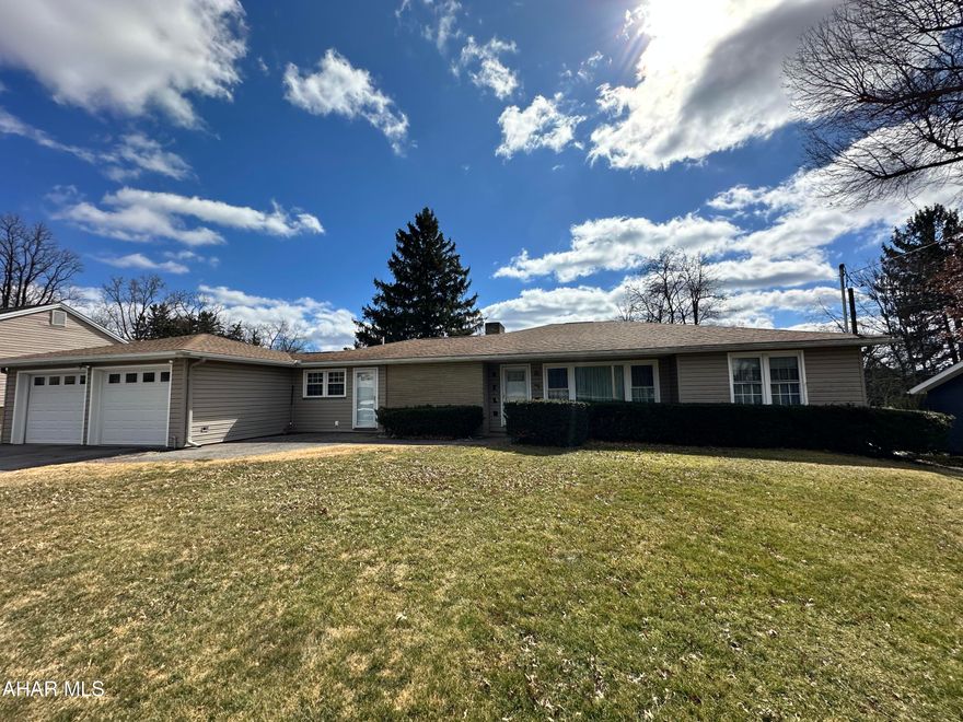 The ease of 1 story living is offered in this 3 bedroom, 1 bath home in the Hollidaysburg School District. Refinished hardwood floors and recessed lights are welcoming in the living room with fireplace. The large oak kitchen with center island is the perfect place to prepare meals and gather with friends. Main floor laundry makes for convenient living. There is an attached 2 car garage and an enclosed rear patio. The furnace and central AC have been recently updated. If you are a person who loves a big garage, boy do we have a great one for you! To the rear of the property you will find a large 5 bay garage with a drywall finished interior. The large lot is 100x349.