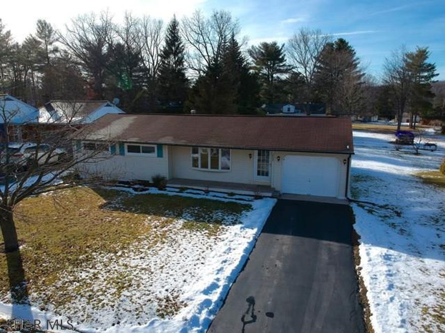 Nicely updated 3 bedroom ranch style home with so much to offer!  Open concept living and dining areas.  Kitchen offers stainless steel appliances and solid countertops.  Updated windows and flooring throughout the home.  All bedrooms have new carpet and large closets. Screened in porch off the rear of the home - perfect for entertaining. Furnace and hot water heater are both less than 5 years old.  1 car garage!