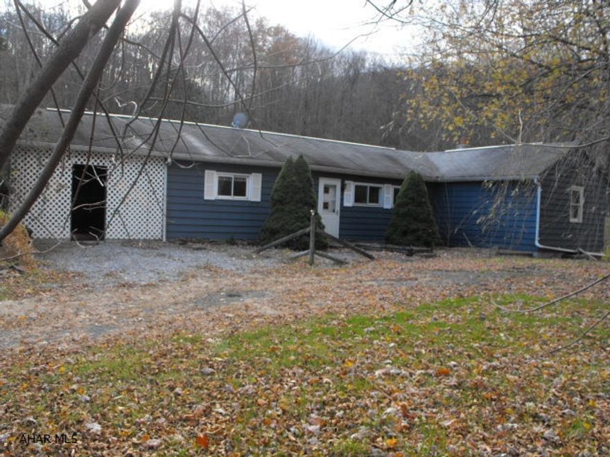 Tons of potential, large room sizes.  Needs modernized.  Electric baseboard heat with woodburner.  20' x 24 dog kennel with 13 pens and runs with heat and water, plus 2 more in separate building and 2 pens in basement.  As is sale per seller.  Offers must be submitted via HUBZU.com.  Buyer must pay $299 technology fee to HUBZU.com @ closing.  For assistance, call Altisource customer care at 855-882-1314.  Only cash or conventional financing will be considered. Spencer Run @ back of property line.