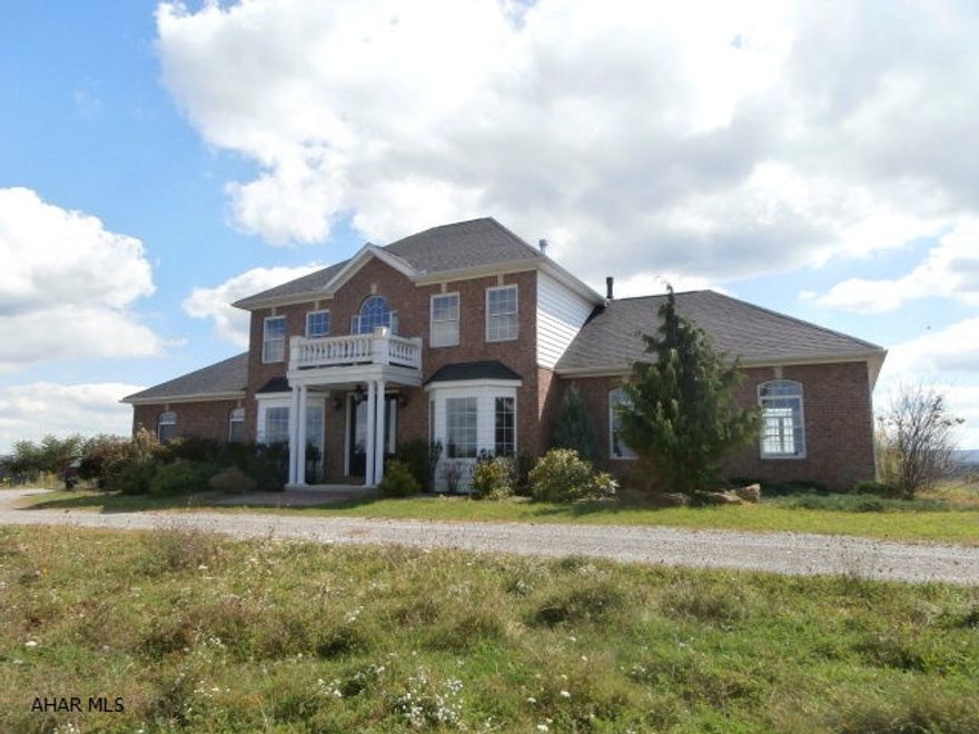 Bank owned - 7 yr old two story with a 40x60 workshop all on 317 acres. Great view. Great value.