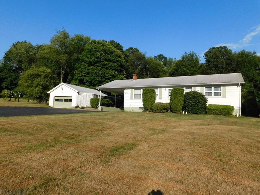 This 1 story has much to offer - Bellwood Schools - over 2 acres.  Large Bedrooms with hardwood under carpet.  Finished basement w/4th BR and attached Breezeway that leads to sun porch and 2 car garage and a circular driveway for easy in & easy out.  Needs some updating but it offers great space.