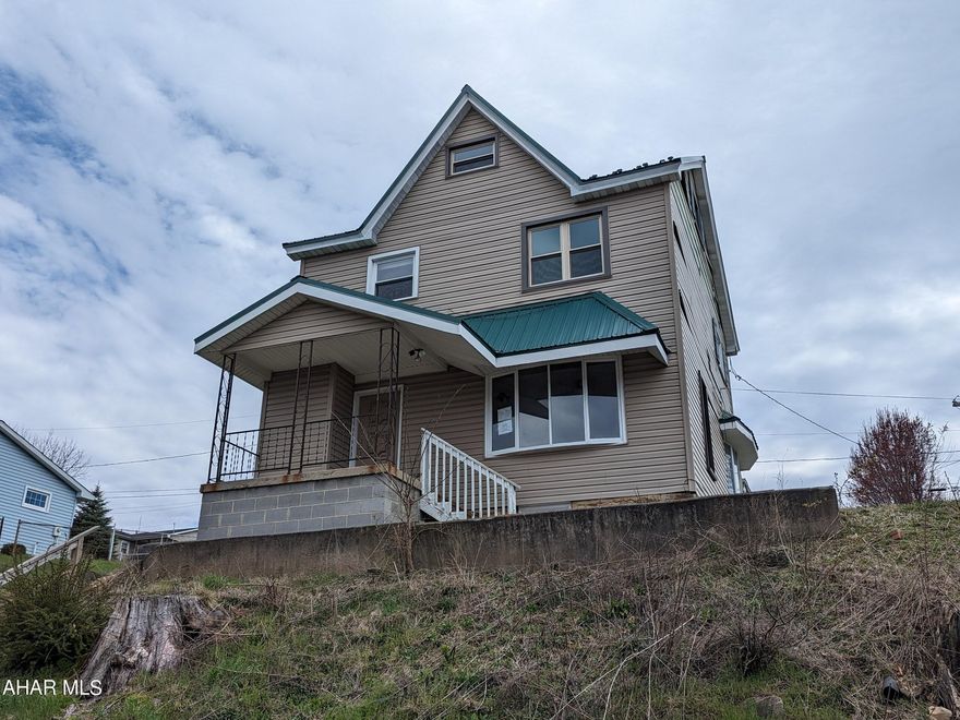 Highland Park - Baker School area! Nice sized 2 story vinyl home with oak kitchen, formal living room and dining room. 3 bedrooms, 1 bath upstairs with finished attic for additional living space. Large concrete block garage, covered rear patio, metal roof & thermo windows. Asset built prior to 1978 lead based paint potentially exists. May qualify for seller financing (Vendee). Buyer pays both transfer taxes.