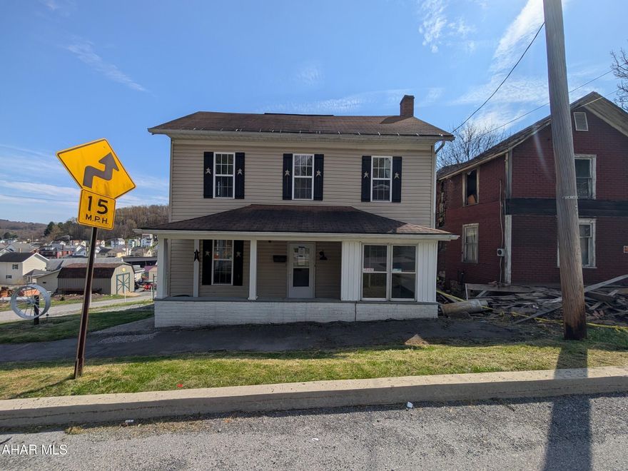 Patton Borough 2 story vinyl is perfect for investors or handyperson! Features large living room and dining room with laminate floors, eat-in kitchen, 1/2 bath and first floor laundry. Second floor includes 2 bedrooms (one with no closet) and full bath. (First floor dining room could serve as a 3rd bedroom.) Walk-up attic for storage, 1 car detached concrete block garage, front and rear covered porch, fenced yard. Buyer to pay any required municipal sewer testing and/or repair escrow. Buyer responsible for required new water meter pit install. BUYER PAYS BOTH TRANSFER TAXES AND DEED PREP.