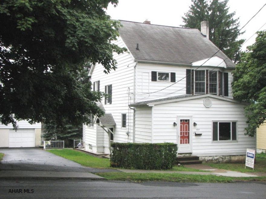 Great area. Flat yard. Large over-sized garage. Needs some TLC. But tons of potential.