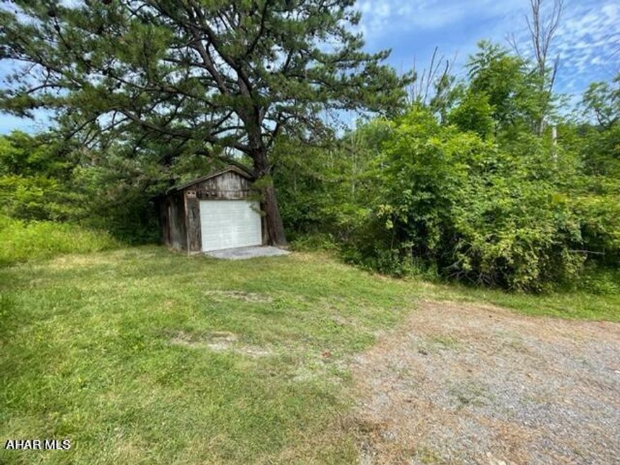 Vacant lot near Penn State Altoona Campus, on just over an acre. Electric is on site and just needs to be connected. Other utilities are all available at the lot. There is currently a one car garage on the property with a new garage door. There is access from a shared driveway plus an unfinished access that would need to be opened and used. Call listing agent for more information.