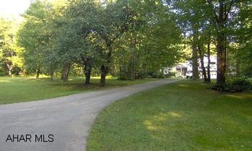 Beautiful split level with private setting on 3.7 acres. Oversized int garage with paved drive, 5 zone hw heat, 2x6 walls, vaulted ceiling, oak flooring, whirpool bath, too much to list. Approx 3000 sq ft.