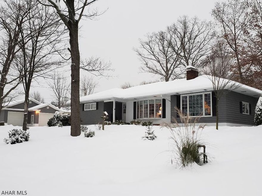 Beautiful 3-bedroom 3-bath home at the end of Washington St.  Home features hardwood, porcelain + ceramic tile floors, chair rail & crown molding throughout main floor, custom-made shelves above windows in Kitchen, Dining Room & Living Room, bath with Jacuzzi tub, natural gas heat + central air, 2 fireplaces + another decorative fireplace & woodburner, seasonal enclosed sun room, finished basement, blacktop drive, shed & large detached 990 sq ft 2-car garage + 2nd lot totaling 1.06 Acre peaceful setting. J-460