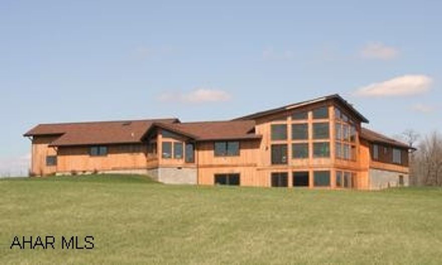 Impressive Contemporary custom built Cedar House on 30.2 Acres with panoramic mountain views. Impressive contemporary custom built cedar house with panoramic mountain views. Open floor plan, 3BR/2BA. Dramatic vaulted ceilings, grand entry with open atrium. Great room w/fireplace, library w/built-in shelves. Conversation pit, hardwood, ceramic tile, recessed and track lighting, stained glass, intercom system. Plenty of windows to bring the outside in! Home has 400 amp electric system. Projected 2010 taxes are $3700. Deed covenants apply.