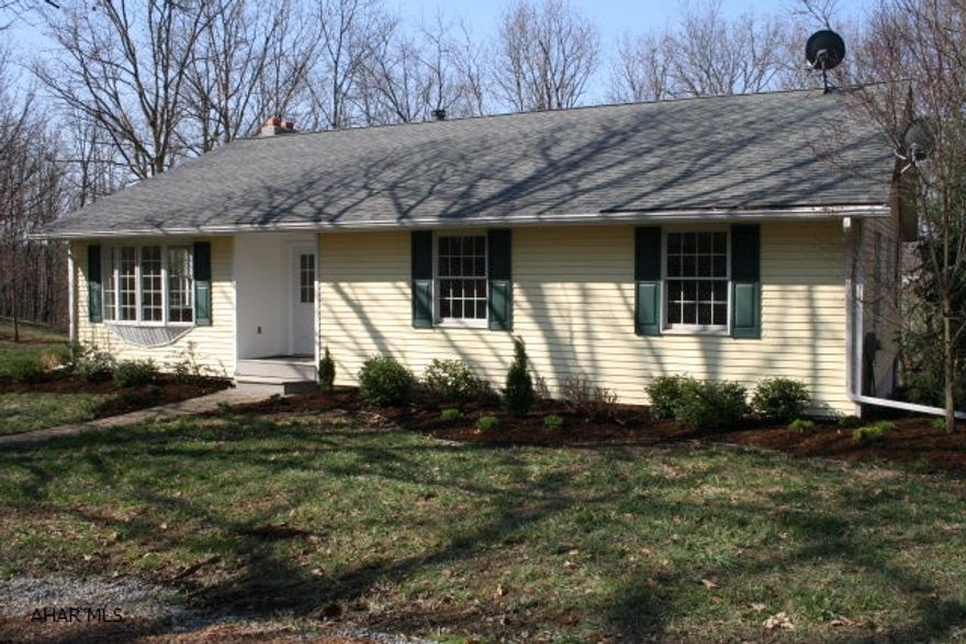 Charming 3BR/2BA Ranch home on 1 acre private setting lot with woodland views. The home is completely updated for today's living including nice kitchen with eat-up bar and all kitchen appliances, hardwood floors in every room, freshly painted with large woodburning stone fireplace in living room. The home has vinyl siding, all new insulated thermal glass windows, new roof and 14'x22' composite rear deck. Relax and enjoy the views in this very pleasant setting.