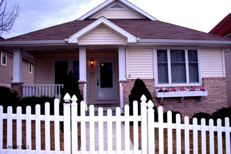 Very nice fenced in yard with shrubs.  Dbl. paved parking in back.