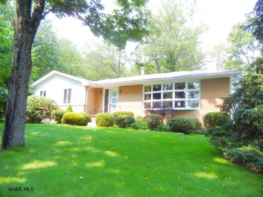 Custom built home by original owners & it shows! Serene setting. New kitchen with beautiful cabinetry, quartz counter tops, tile back splash, double ovens & cook top. Family room with built in cabinetry and wired for surround sound. Fireplace currently hooked up to gas but could be converted back to wood burning. Oversized two car garage. Enjoy the privacy of the deck off the kitchen. Must see today. This will not last long.