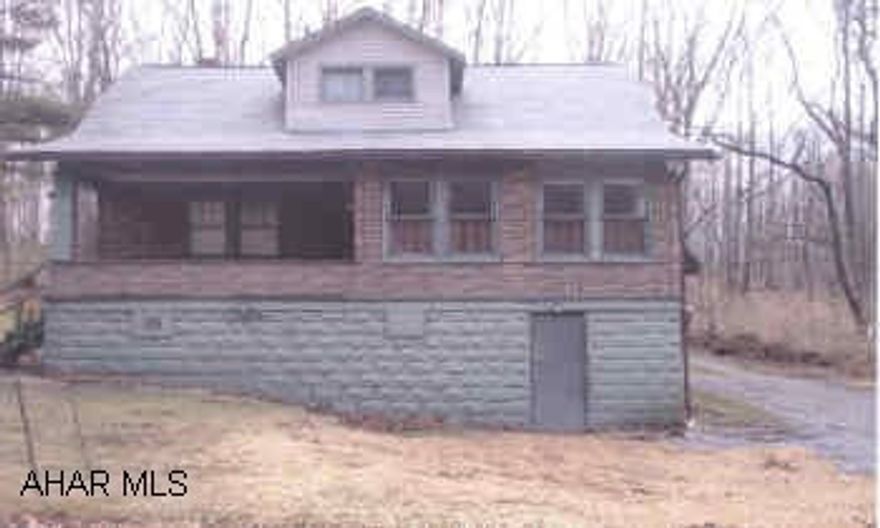 2 story, 2 bedroom, 2 car garage, 1.75 baths,  Secluded location on Blooms Road.  Great potential.