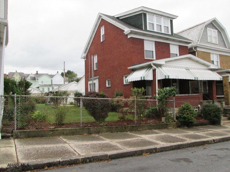 Beautiful brick home with so much to offer!  Semi-open floor plan from kitchen to dining room.  Spacious living room that features a gas fireplace.  Convenient first floor laundry and bathroom.  A finished attic that would make a great 4th bedroom.  Hardwood floor under carpet. Partially finished basement that is great for entertaining.  Large 2 car garage with separate doors.  Gorgeous landscaping, double lot, and off-street parking.  The first time buyer will love all the added features of this terrific home!