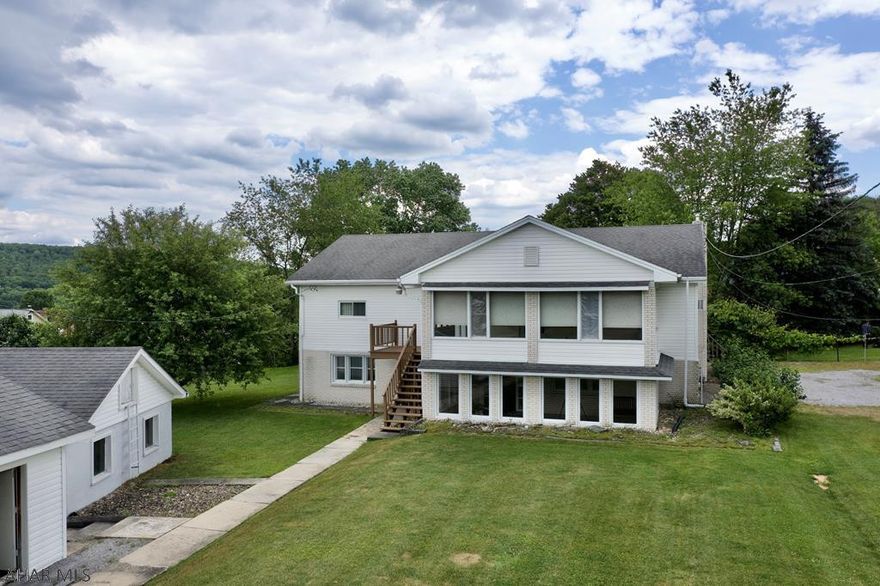 Charming 3 bedroom, 2 full bath raised ranch home in the borough of Nanty Glo. This home offers custom built kitchen cabinets, slate tile flooring in lower level bathroom, oak trim, endless storage options throughout the entire house, two huge enclosed sunrooms, and so much more! The bedrooms will each fit king sized beds and have large closets.  The lower level can be made into an in-law suite with its private access and full bath or could be used for a business!  The possibilities are endless!  The lower level has a separate utility room and laundry room. Large yard with 2 Detached Garages and plenty of off street parking!  The home even has a brand new natural gas boiler making for low utility bills.