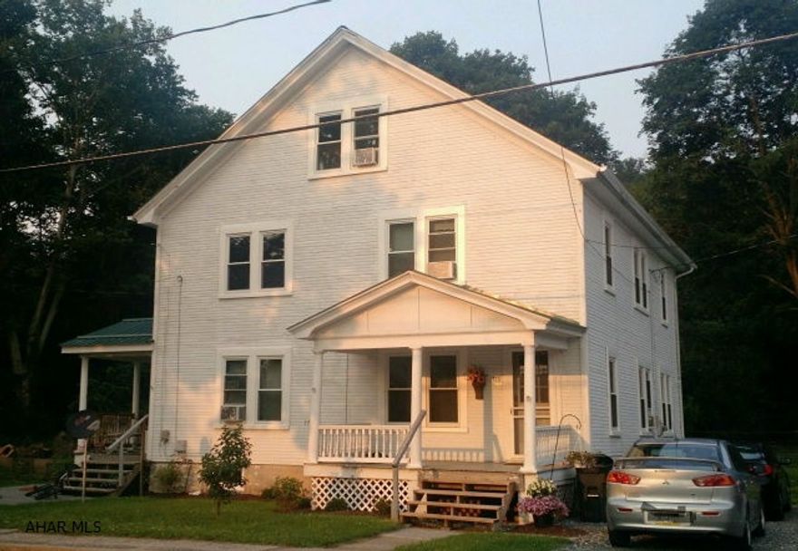 Spacious duplex on a quiet, large level lot in Claysburg. The entire building has new thermo pane windows with lifetime warranty. Each unit includes three bedrooms (with potential for a fourth on the third floor - in walk up attic), a kitchen, dining room (with built-ins), living room and basement. The units also have separate utilities, individual heating systems, newer roof and front and rear porches. One side of the duplex is already rented and generating income. You could live in one side and rent the other side to a tenant. Apt. 2 features new back door to porch, updated bathroom with grouted tile floor, laminate flooring.